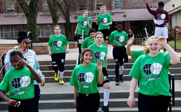 Unity Games participants running down stairs