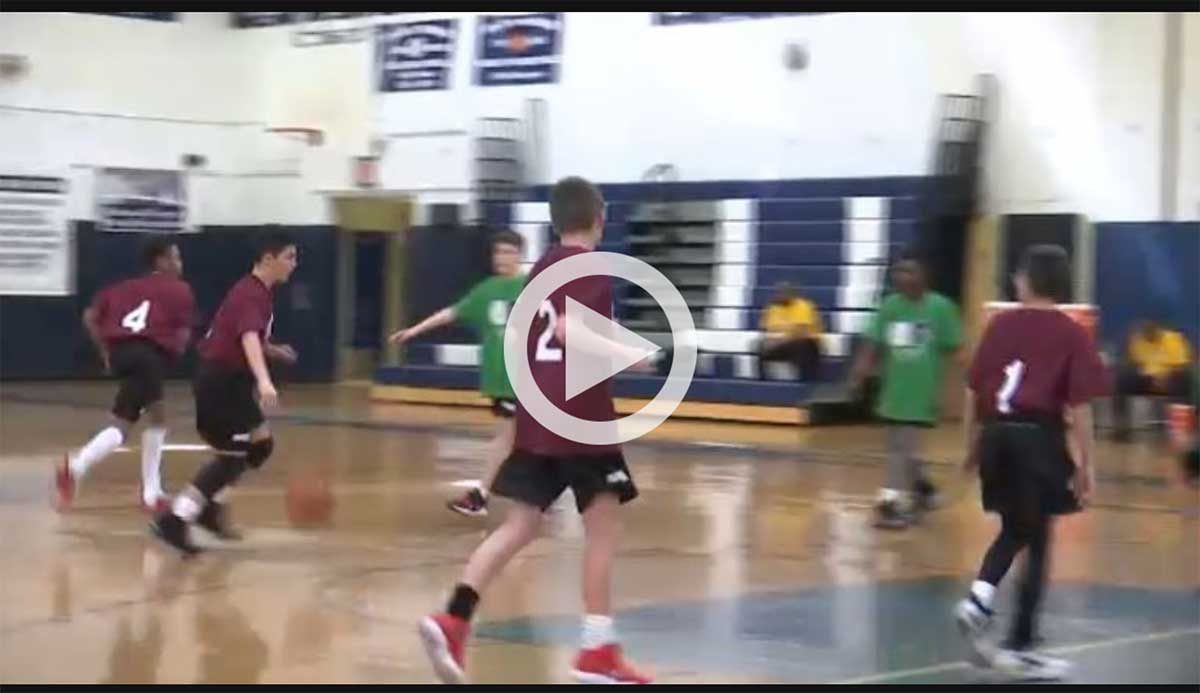 video frame of boys playing basketball